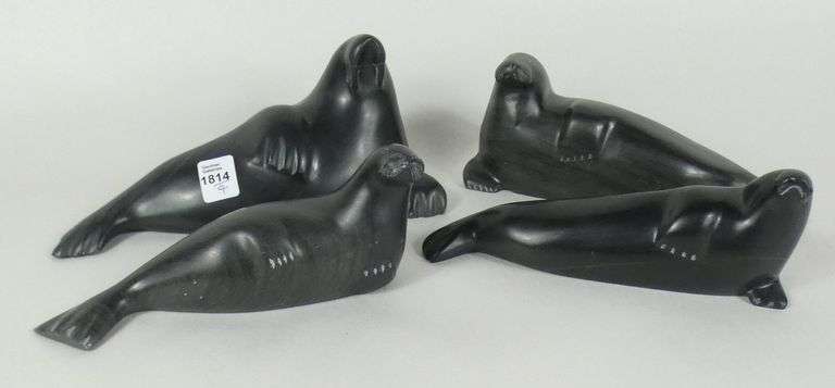 FOUR INUIT STONE CARVINGS