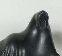 FOUR INUIT STONE CARVINGS