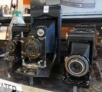 FOUR ANTIQUE BELLOWS CAMERAS