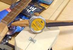 THREE HOMEMADE INSTRUMENTS AND WALL ART