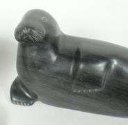 FOUR INUIT STONE CARVINGS