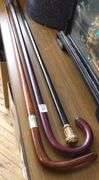 TWO WALKING STICKS AND CANE