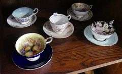 FIVE ENGLISH CUPS AND SAUCERS