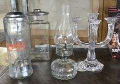 TWO JARS, OIL LAMP AND CANDELABRUM