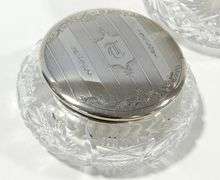 THREE STERLING LIDDED DRESSER JARS