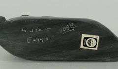 FOUR INUIT STONE CARVINGS