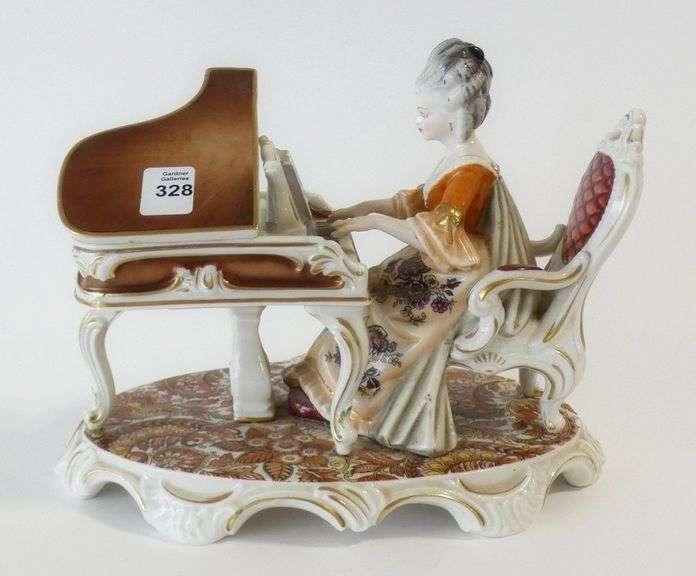 GERMAN PORCELAIN "FEMALE PIANIST" FIGURINE