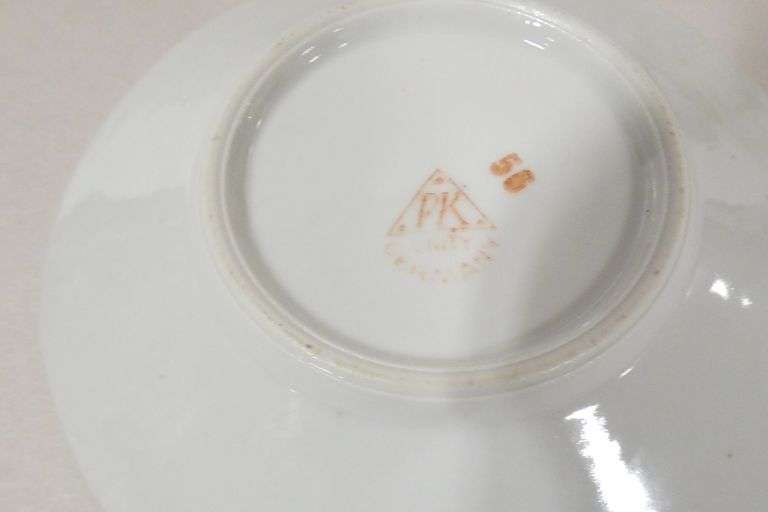 TWO BUTTERFLY HANDLE CUPS AND SAUCERS