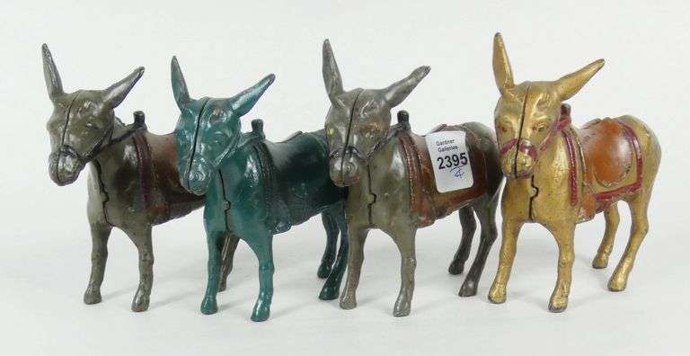 4 "DONKEY" CAST IRON BANKS
