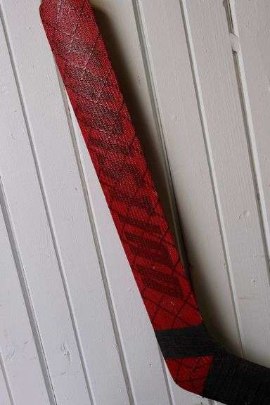 HOCKEY GOALIE STICK AND GLOVE