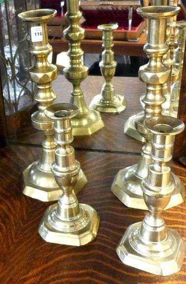 TWO PAIRS OF ANTIQUE BRASS CANDLESTICKS