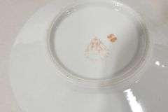 TWO BUTTERFLY HANDLE CUPS AND SAUCERS
