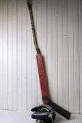 HOCKEY GOALIE STICK AND GLOVE