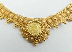 GOLD NECKLACE WITH "COINS"
