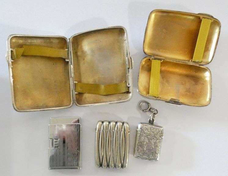 STERLING CIGARETTE CASES, MATCH VESTAS AND LIGHTER