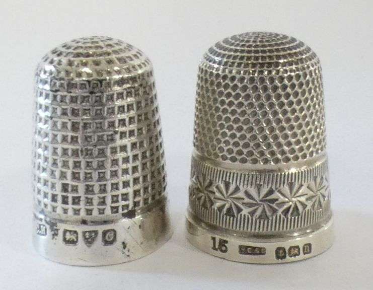 TWO STERLING THIMBLES