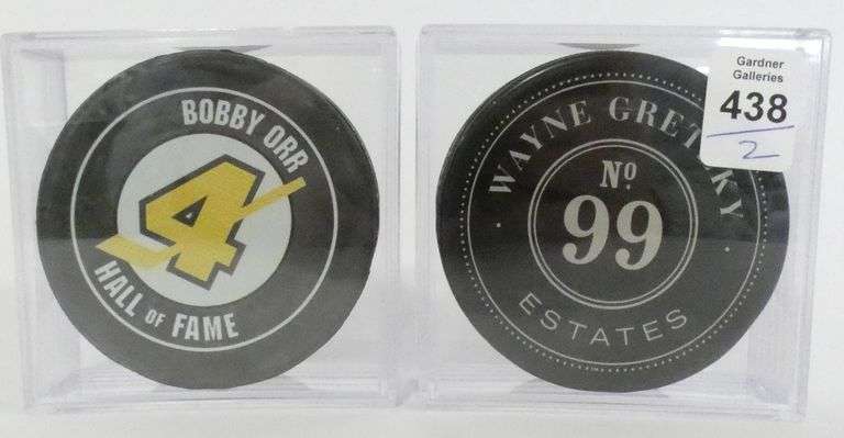 TWO COLLECTIBLE HOCKEY PUCKS