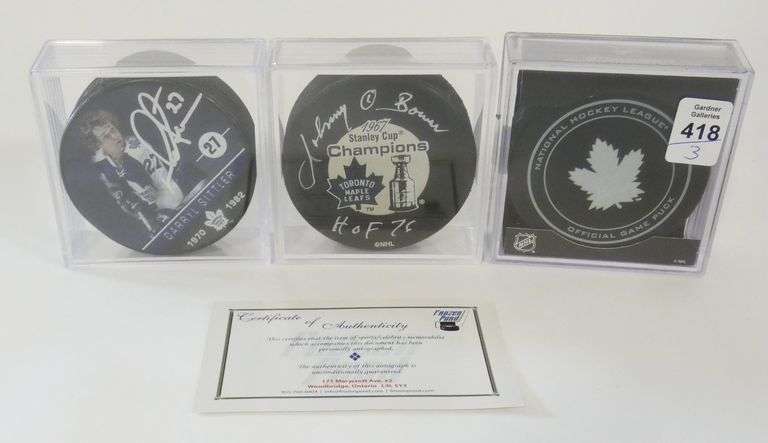 THREE "TORONTO MAPLE LEAFS" PUCKS