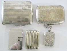 STERLING CIGARETTE CASES, MATCH VESTAS AND LIGHTER