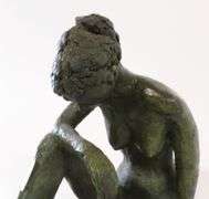 BRONZE "SEATED FEMALE NUDE" SCULPTURE