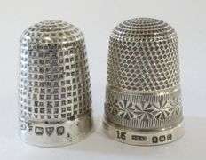 TWO STERLING THIMBLES