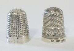 TWO STERLING THIMBLES