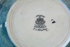 TWO ENGLISH ART POTTERY PLATES