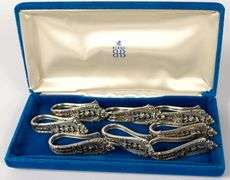 SET OF EIGHT WALLACE "ROSE POINT" STERLING NAPKIN RINGS