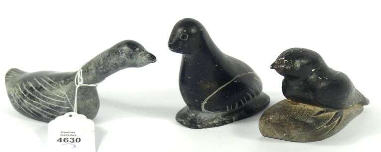 THREE INUIT STONE CARVINGS INCLUDING SYOLLIE AWP