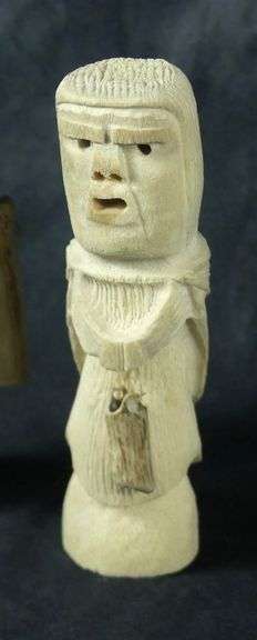 TWO INUIT TUPILAK CARVED FIGURES