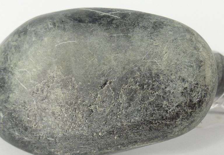THREE INUIT STONE CARVINGS INCLUDING SYOLLIE AWP