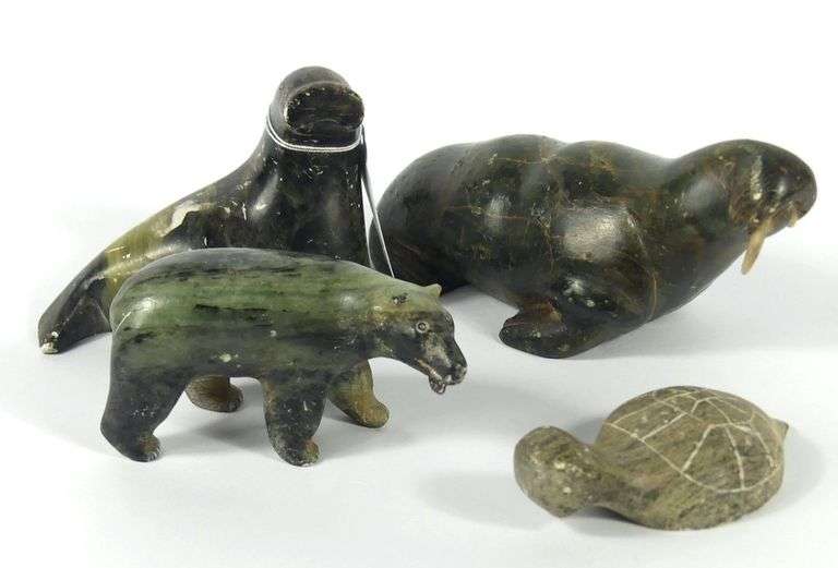 FOUR INUIT CARVINGS