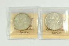 2 GRADED CANADIAN SILVER DOLLARS