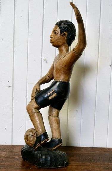 CARVED WOOD FOOTBALLER