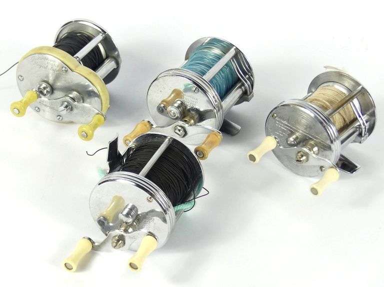 FOUR VINTAGE REELS