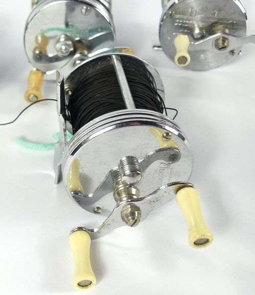 FOUR VINTAGE REELS