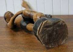 CARVED WOOD FOOTBALLER