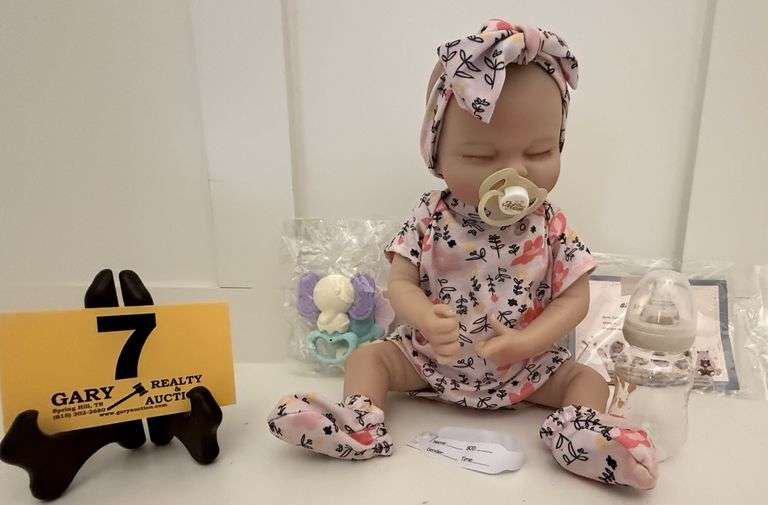Reborn Baby Doll: Life-like baby doll with bottle, toys, pacifier and birth certificate