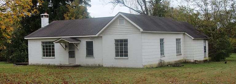 Older home in need of much repair or tear down. Home has 7 rooms with floor system damage in some ro