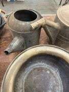 Brass buckets, watering cans