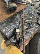 Tower fan, roll of plastic, fishing pole, shop sweeper