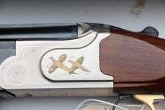 Mossberg Silver Reserve  .12 NIB