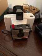 Polaroid cameras, dvds, records etc