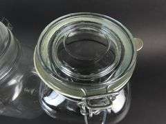Lot of 4 Glass Cannisters with Lids