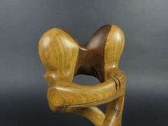 Handcrafted Carved Wooden Sculpture of a Couple Embracing