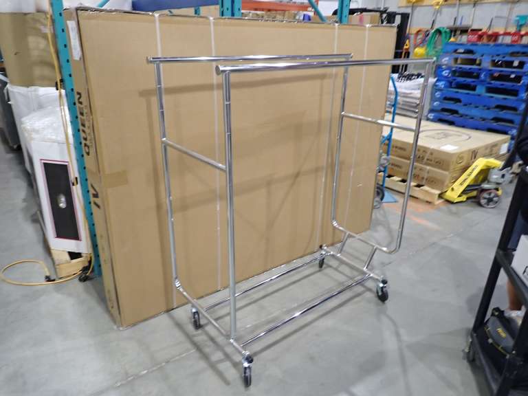 Lot of (7) Mobile Double Bar Retail Clothing Racks and (2) Mobile Single Bar Retail Clothing Racks.