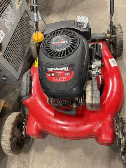 Two Push Lawn Mowers