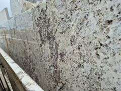Slab of Granite Irregular Shape (White with Grey/Beige/Brown/Light Purple Speckled Pattern)
