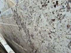 Slab of Granite Irregular Shape (White with Grey/Beige/Brown/Light Purple Speckled Pattern)