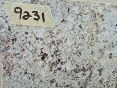 Slab of Granite Irregular Shape (White with Grey/Beige/Brown/Light Purple Speckled Pattern)